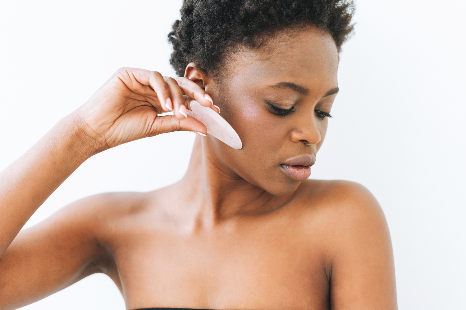 Gua sha facial massage benefits and how to use it safely