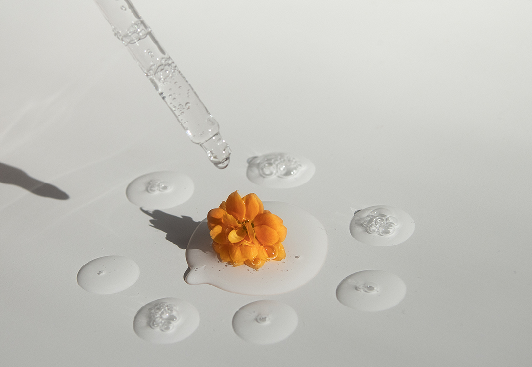 Minimalist skincare products arranged on a clean, simple surface