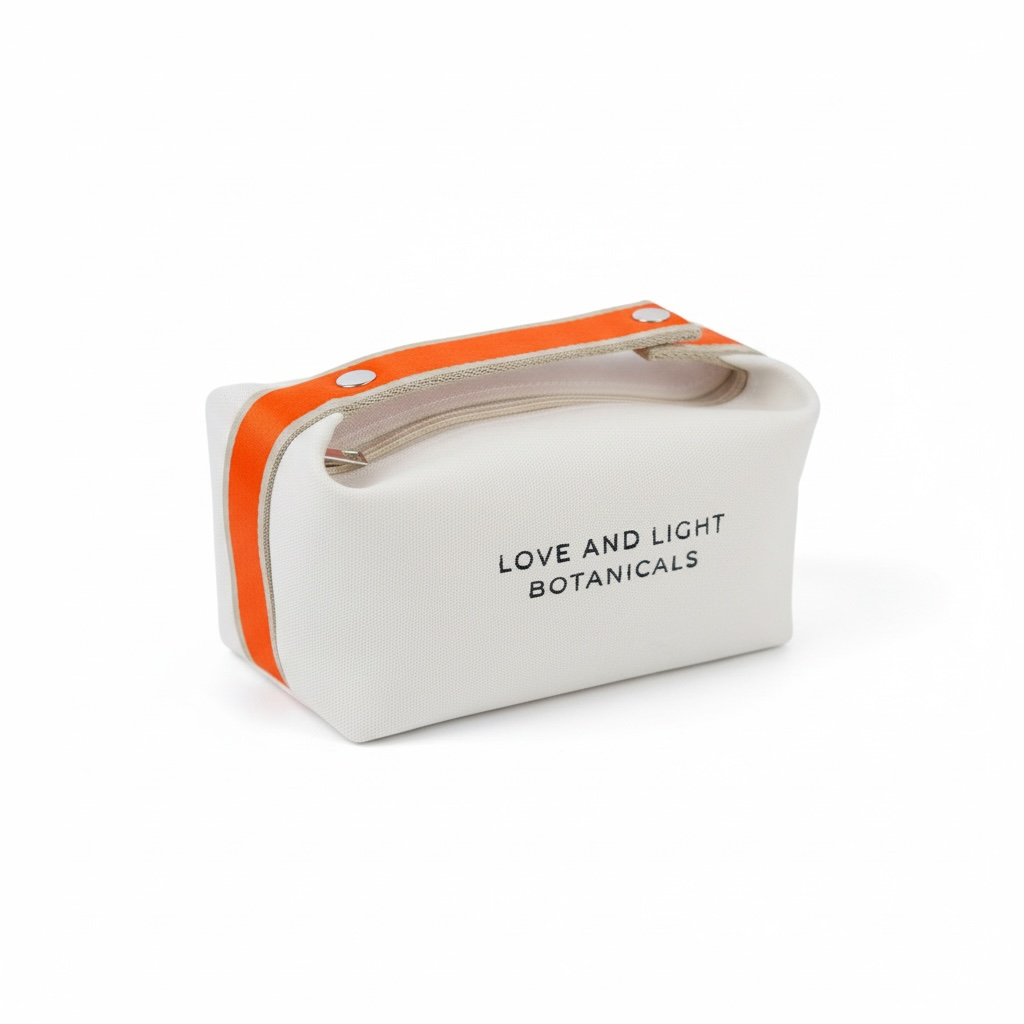 White hemp-jute cosmetic case with tangerine handle, angled view showing the zip top