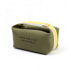 Sage hemp-jute cosmetic case with sunshine yellow handle, angled view