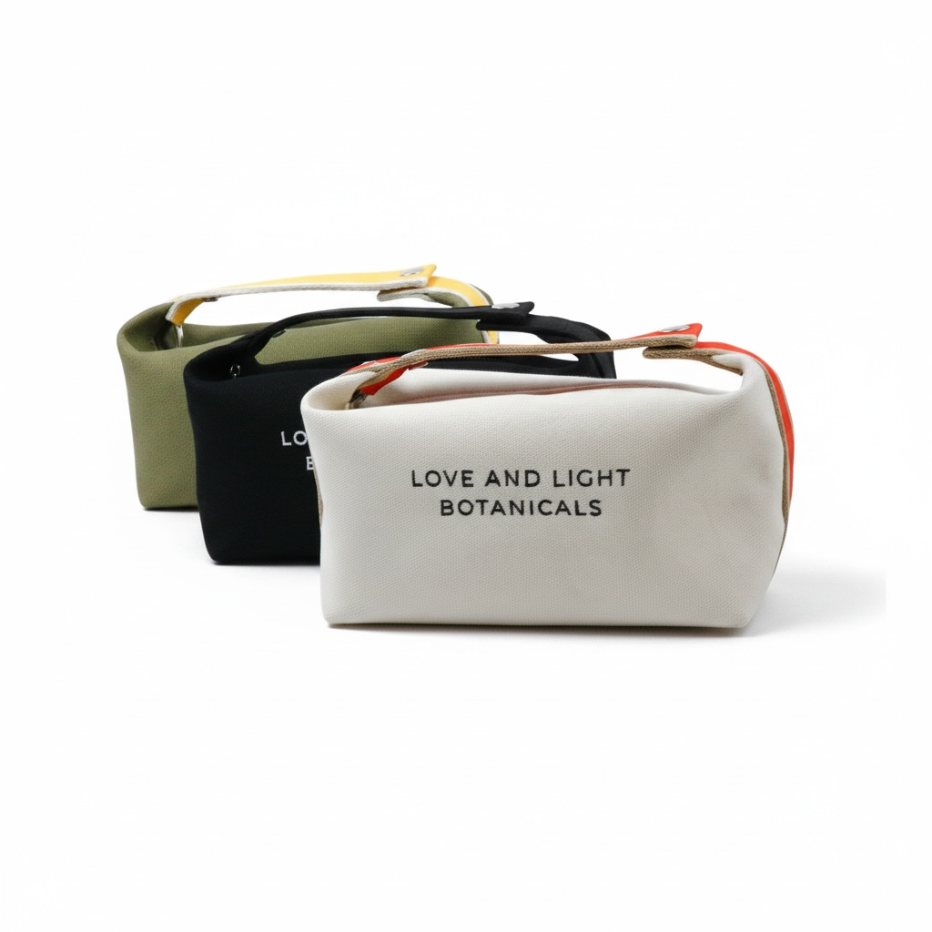 Three hemp-jute cosmetic cases in sage, black + white with contrasting carry handles
